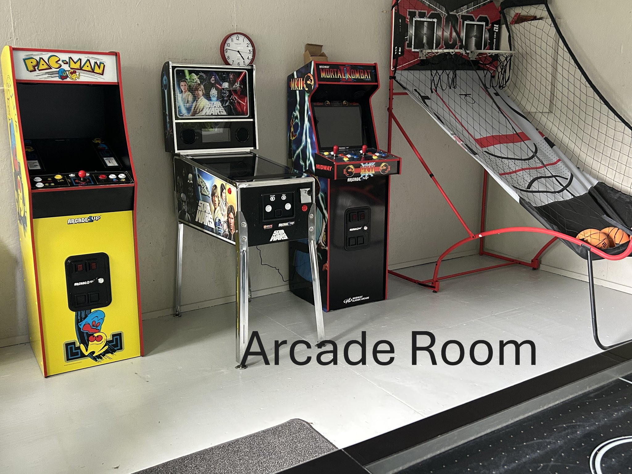 Arcade room with Pac-Man, Star Wars pinball, and Mortal Kombat